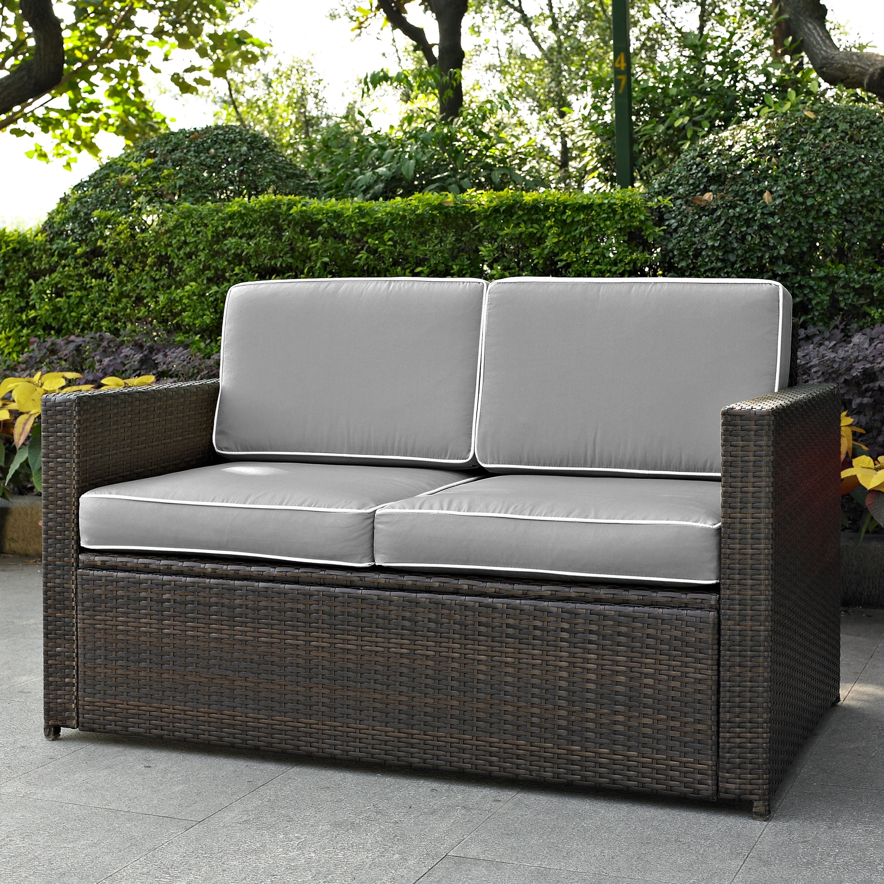 Palm Harbor Outdoor Wicker Loveseat In Brown With Grey Cushions